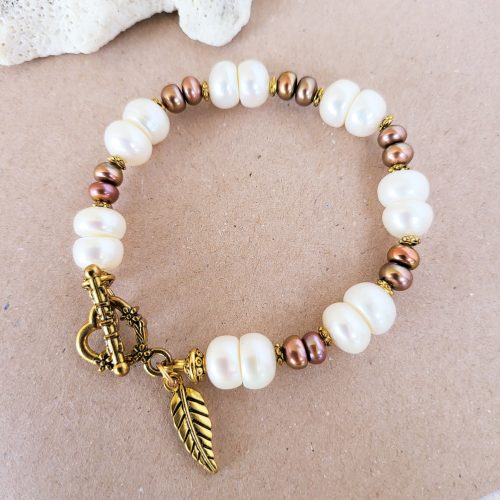 White and brown pearl bracelet with leaf charm